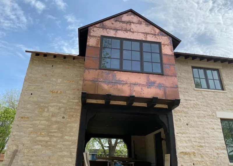 Copper metal panel facade on a stone building for Skylight Installation in Lower Moreland