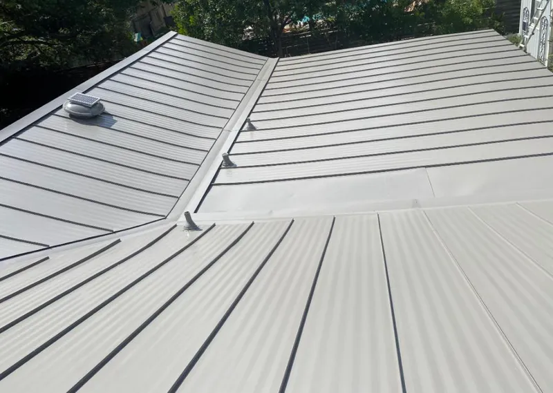 Solar attic fan installed on a metal roof for Roof Ventilation in Lower Moreland